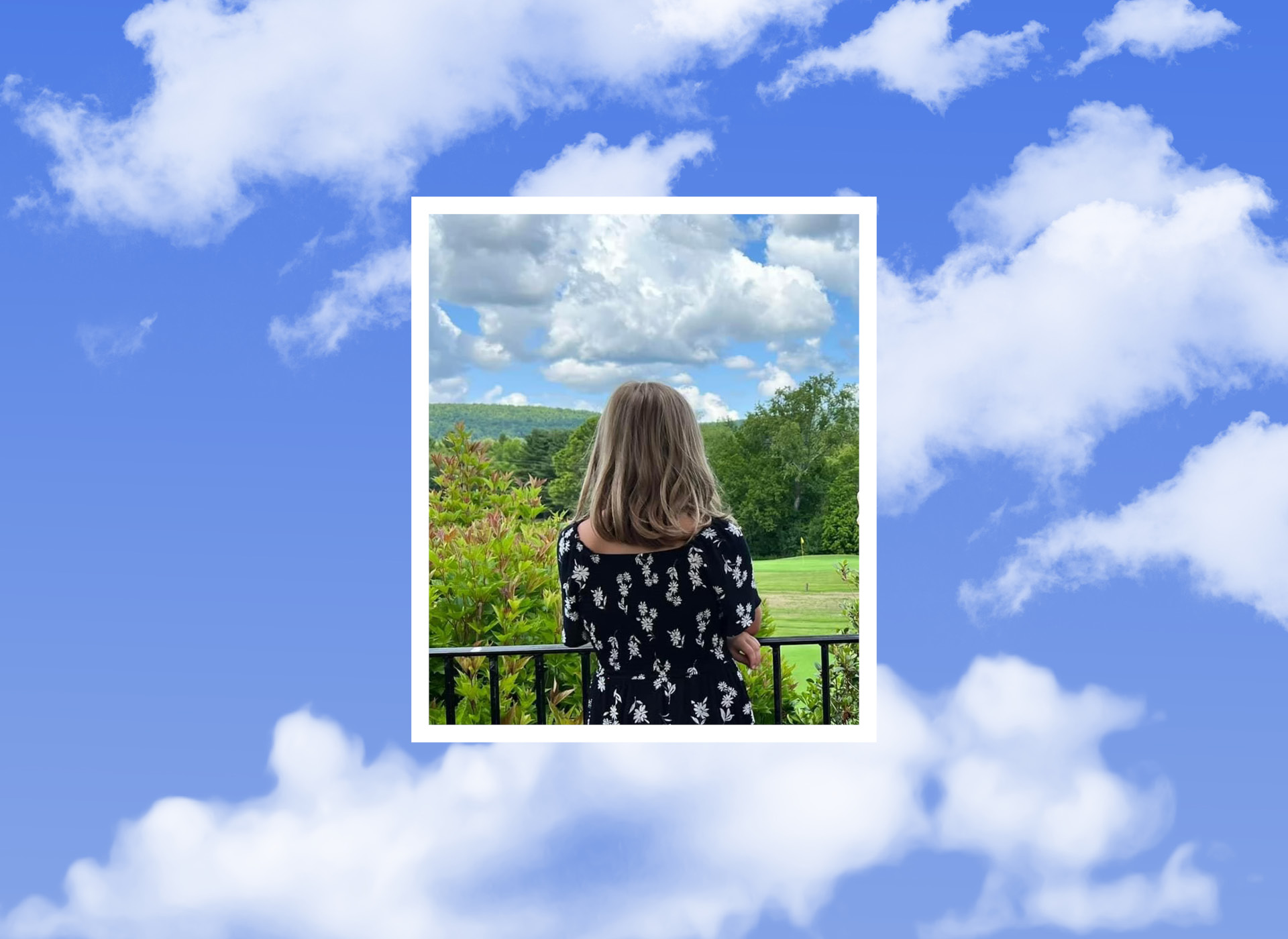 image of blonde little girl from behind looking out at a field against a sky with clouds background