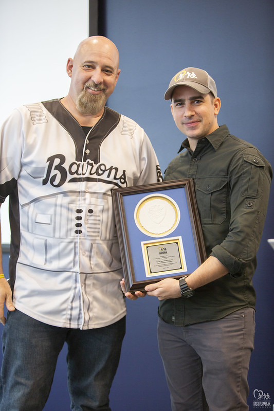 Deputy Assistant Director Dave Denton from Homeland Security Cyber Crimes Center accepting a Heroes Award on behalf of the agency, from Callahan Walsh.