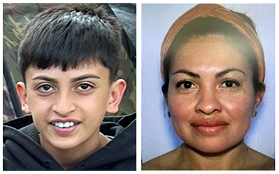 young boy with dark hair and smiling; woman with hair up