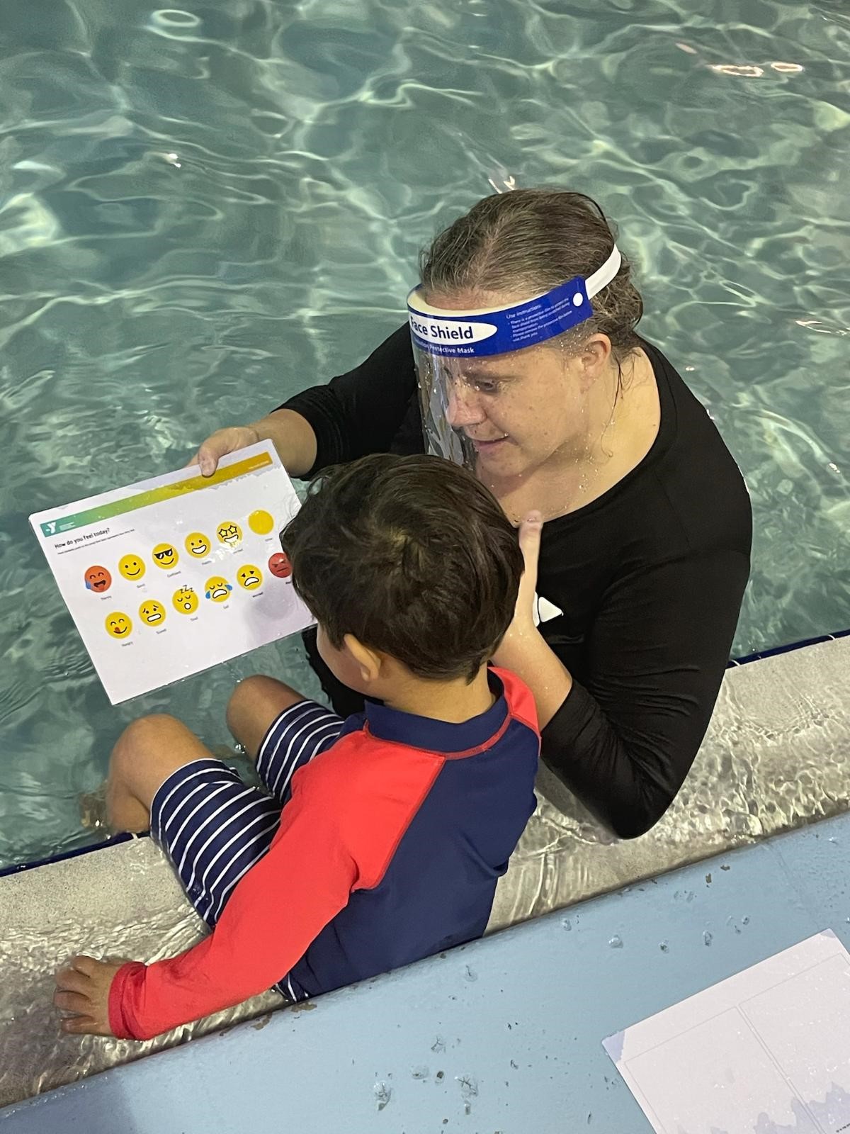 swimming coach and child