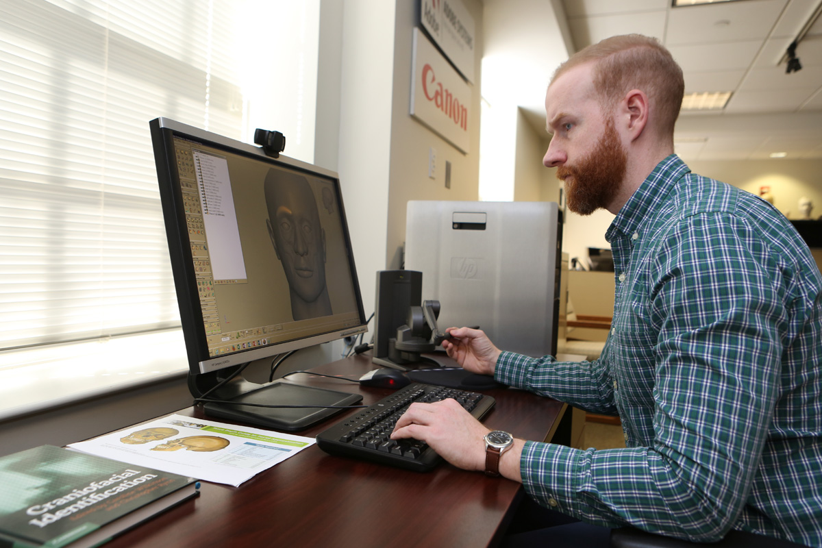 NCMEC employee working on computer