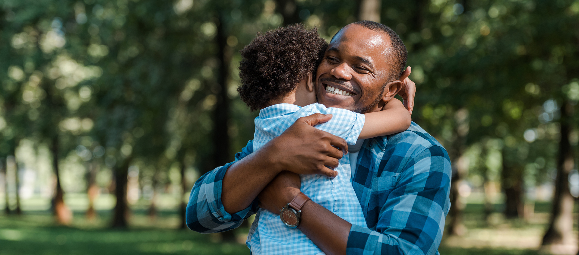 Father hugging child