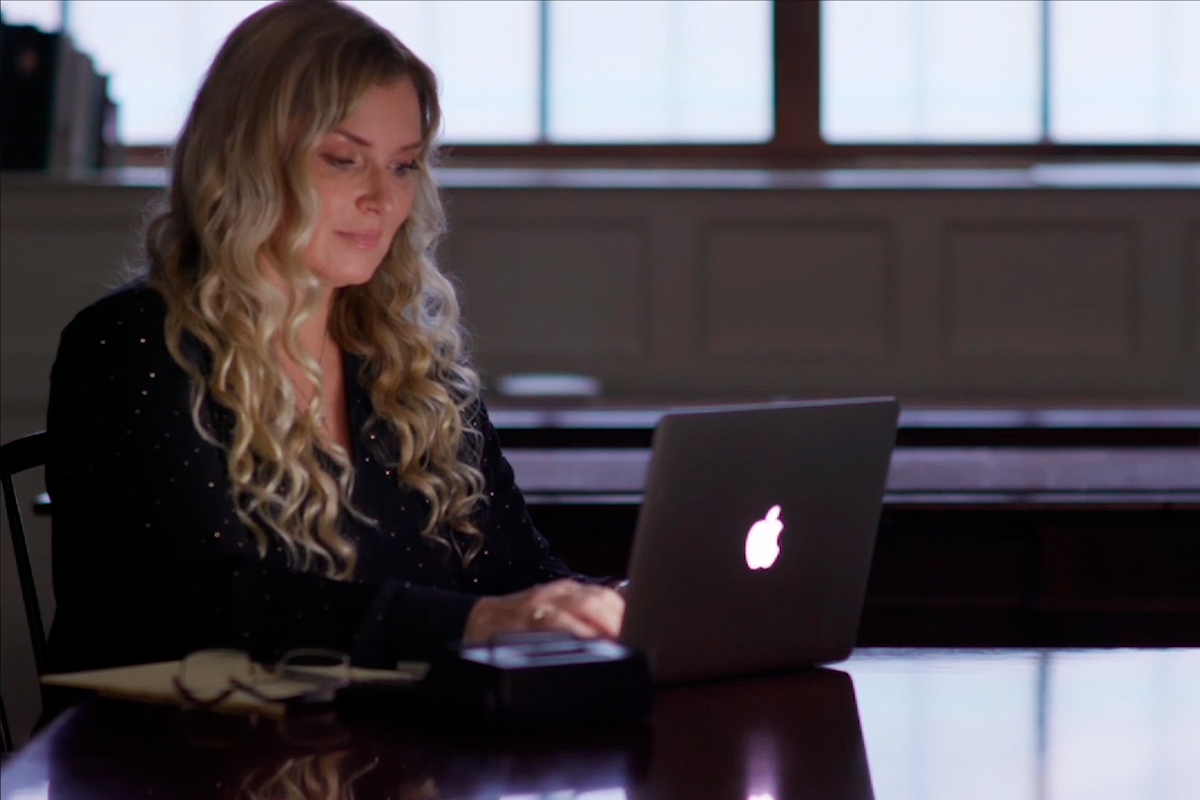 genealogist working on laptop