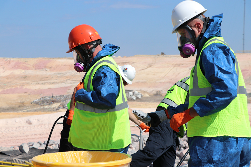 Searchers wearing protective gear