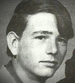 black and white photo of danny rollings as a teenager. dark hair swept to side