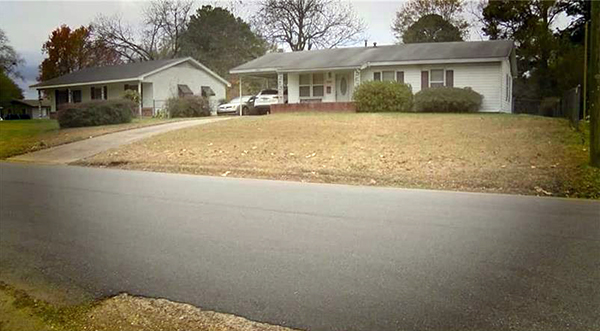 david's house -- one level white house with black roof and big front yard