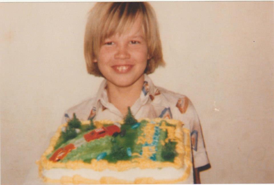 David holding a birthday cake