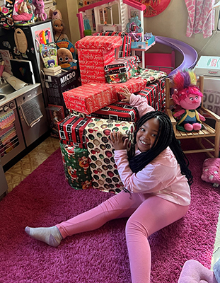 April with unopened Christmas and birthday presents