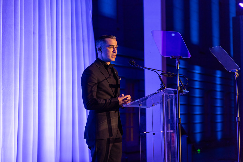 Cal Walsh, son of John and Reve′ Walsh, presents Hope Award to John.