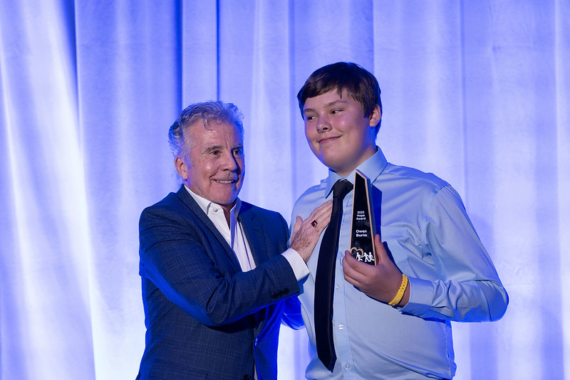 John congratulates Owen Burns.