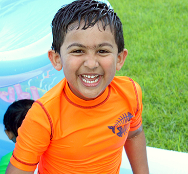 boy in orange shirt