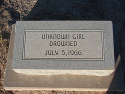 Grave stone that says "Unknown girl drowned"