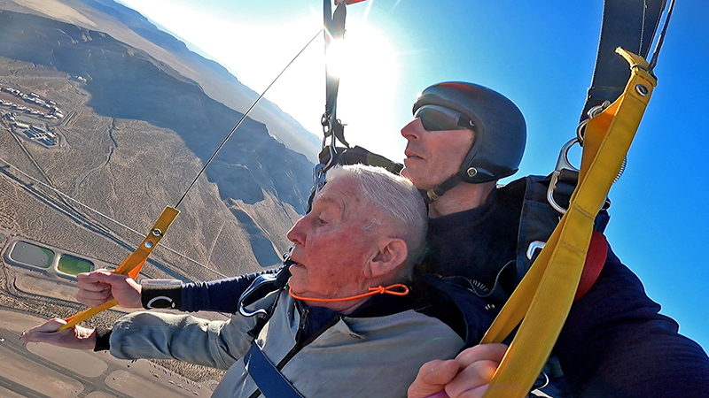 GoPro captures John’s leap from plane on 80th birthday.