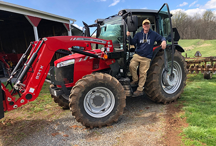 John Clark on a tractor