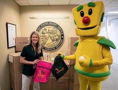 USSS Ambassador Mandy Rowe and NCMEC’s Mascot, Clicky.