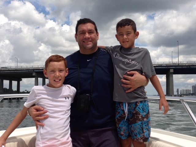 Mena and 2 boys on boat