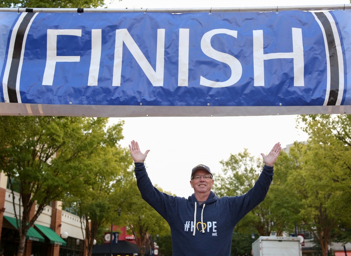 NCMEC President and CEO John Clark at the finish line of last year’s run.