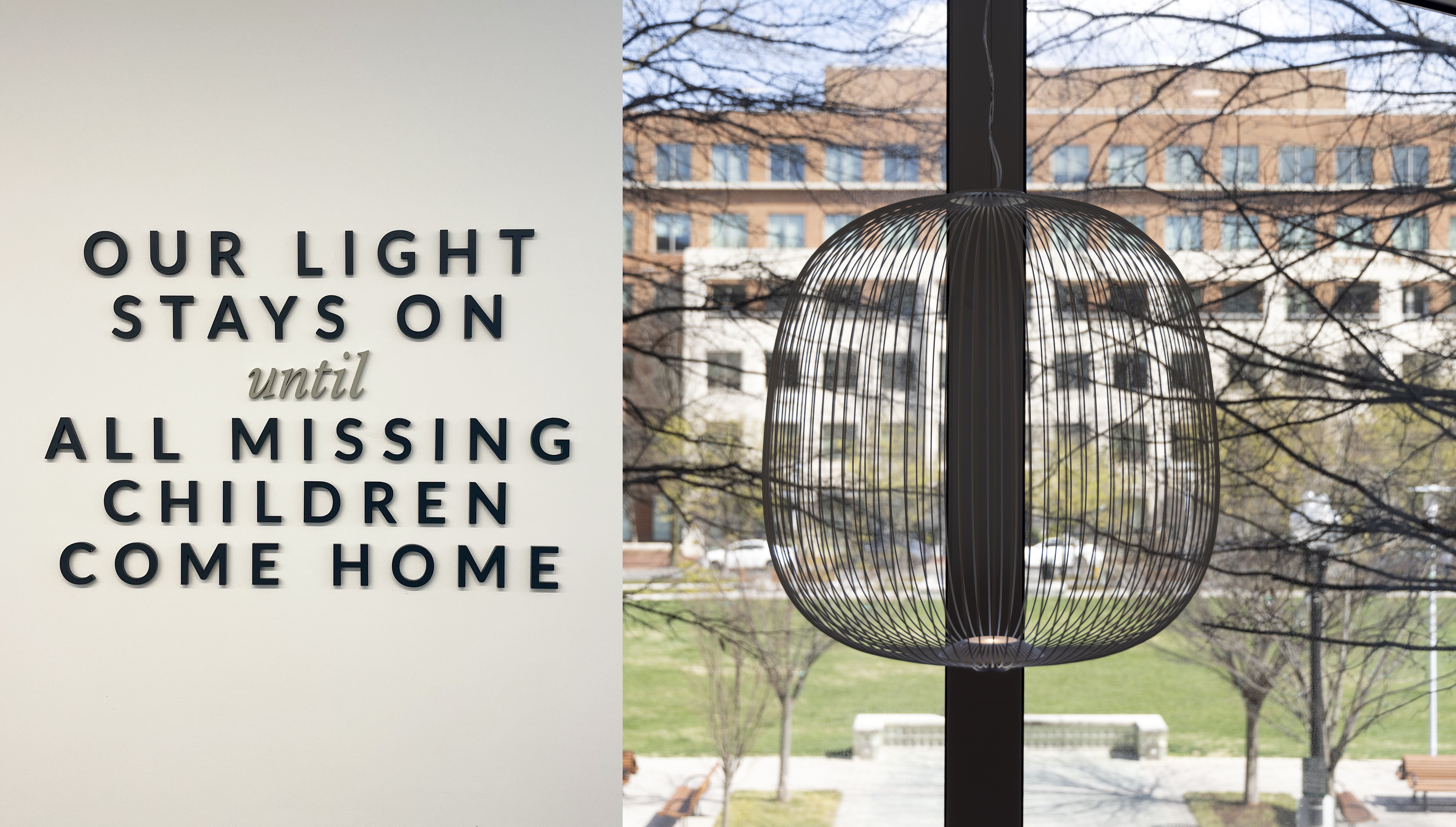 copy: "our light stays on until all missing children come home" (left); image of wire lamp with light on overlooking a park (right)