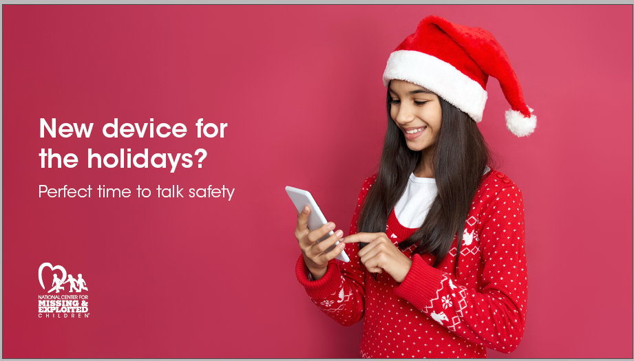 teen girl wears red and santa hat, has phone in hands