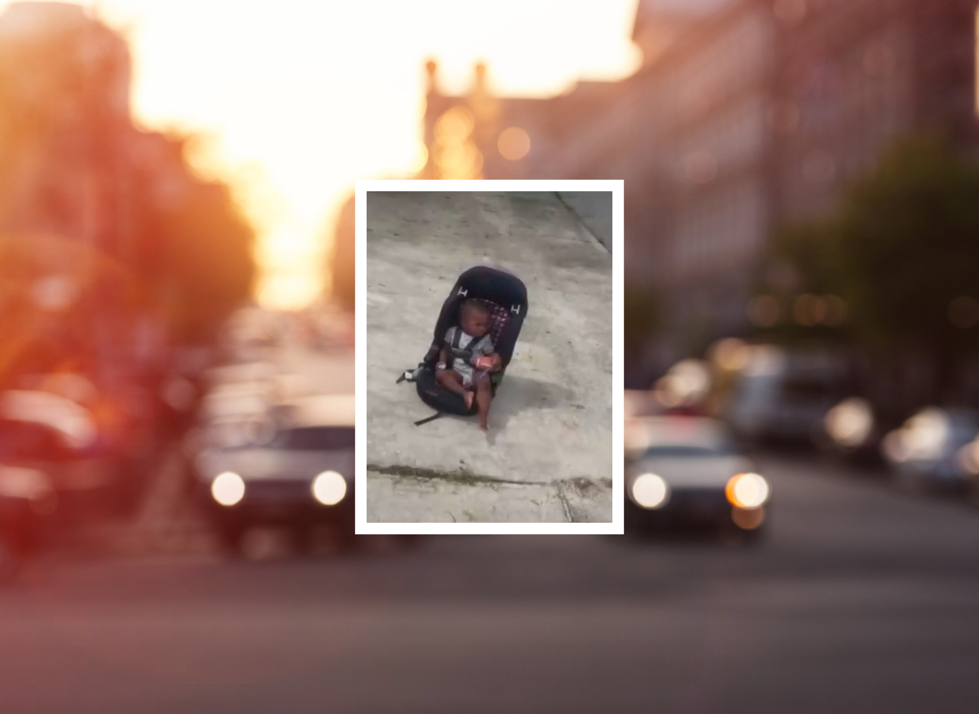 photo of baby left in carseat in driveway. blurry photo of traffic in the background