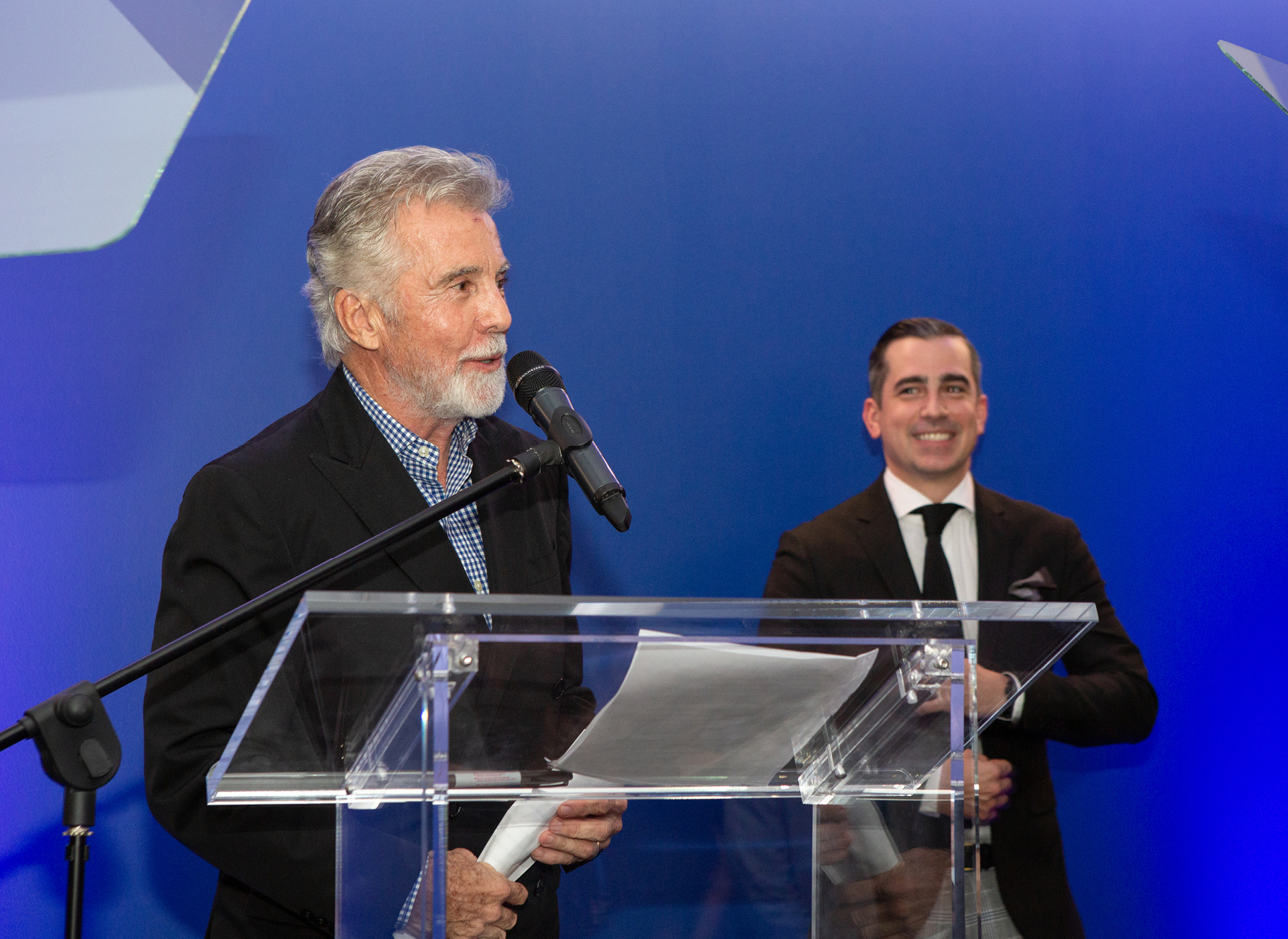 John Walsh shaking the hand of an award recipient