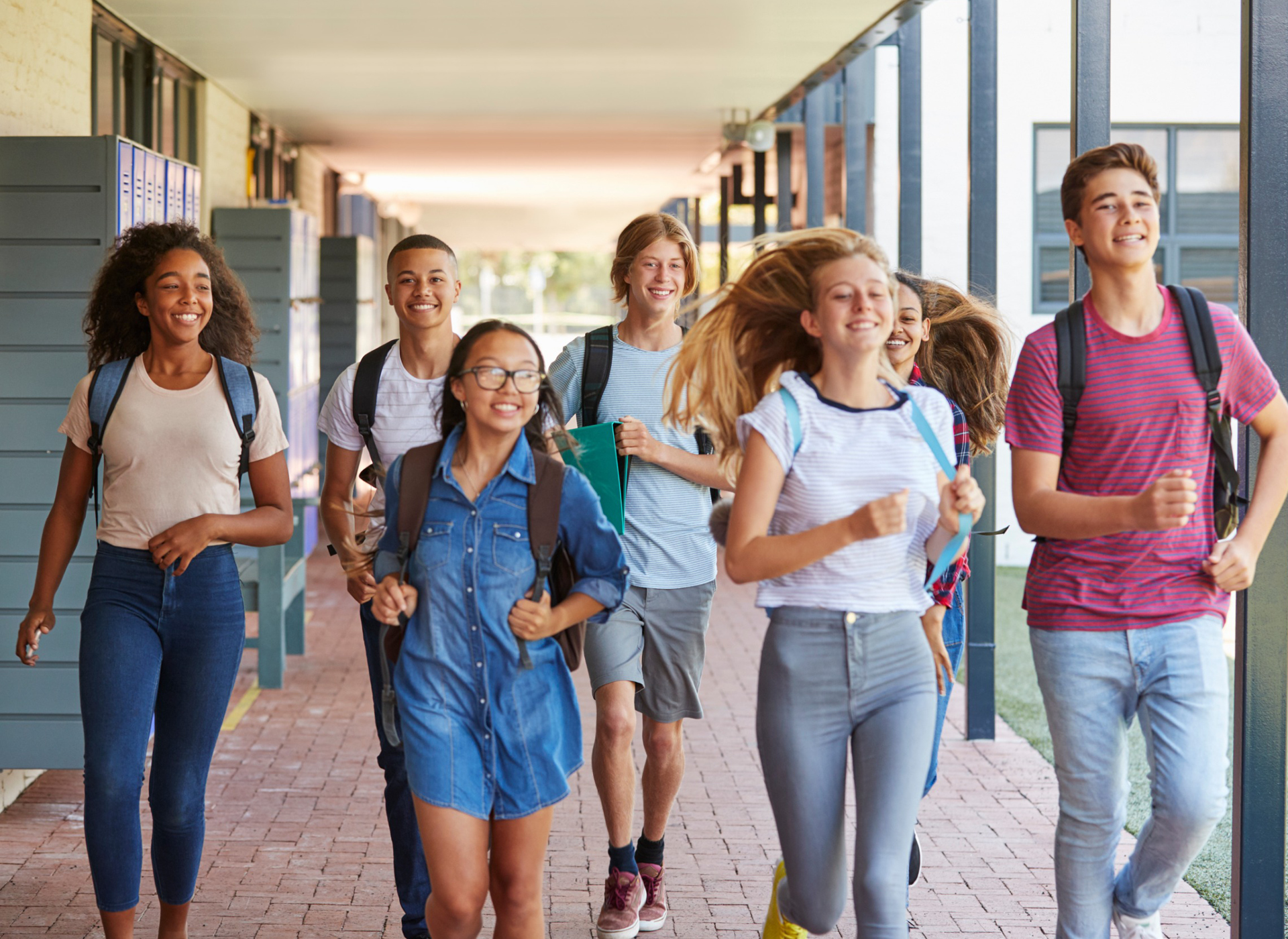 Teenagers walking around at school