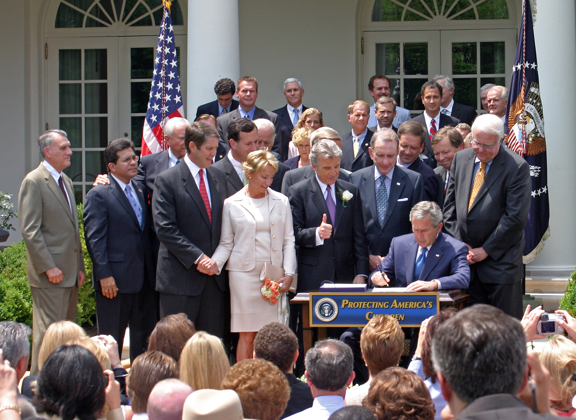 President George Bush signs the Adam Walsh Child Protection and Safety Act