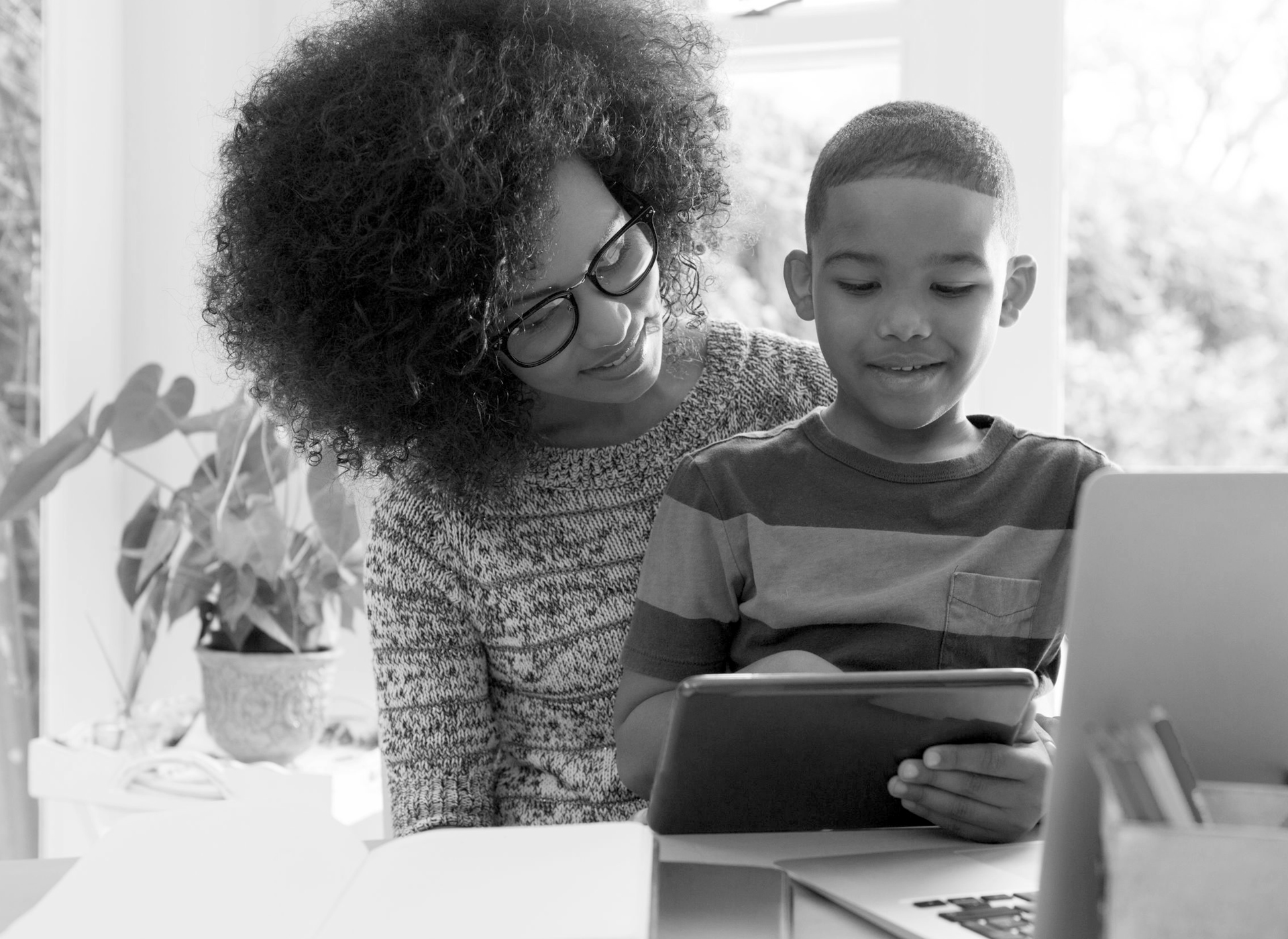 mother and son looking at tablet