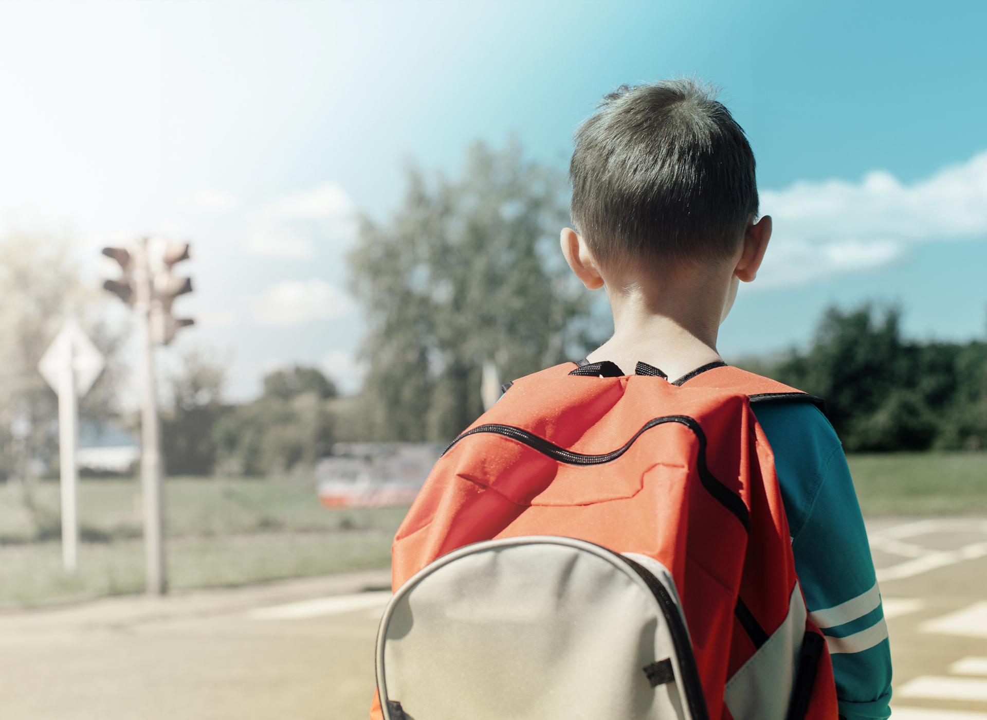 Boy with backpack on