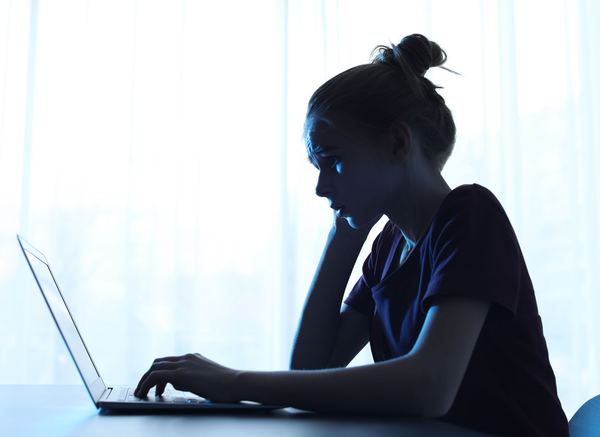 girl looking at laptop 