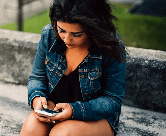 Teen looking at a phone